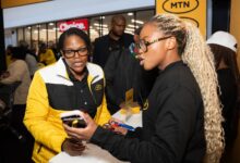 MTN staff assist customers at a branded activation event, highlighting the company's growing focus on digital services and content platforms.