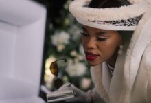 Gugu Gumede as Joyce Gomora at Jonasi Gomora's funeral in Netflix's South African drama The Polygamist, which follows a wealthy family's unraveling after years of deception and secret relationships.
