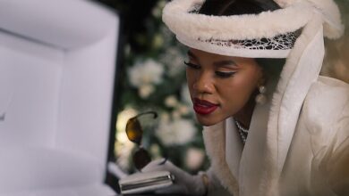 Gugu Gumede as Joyce Gomora at Jonasi Gomora's funeral in Netflix's South African drama The Polygamist, which follows a wealthy family's unraveling after years of deception and secret relationships.