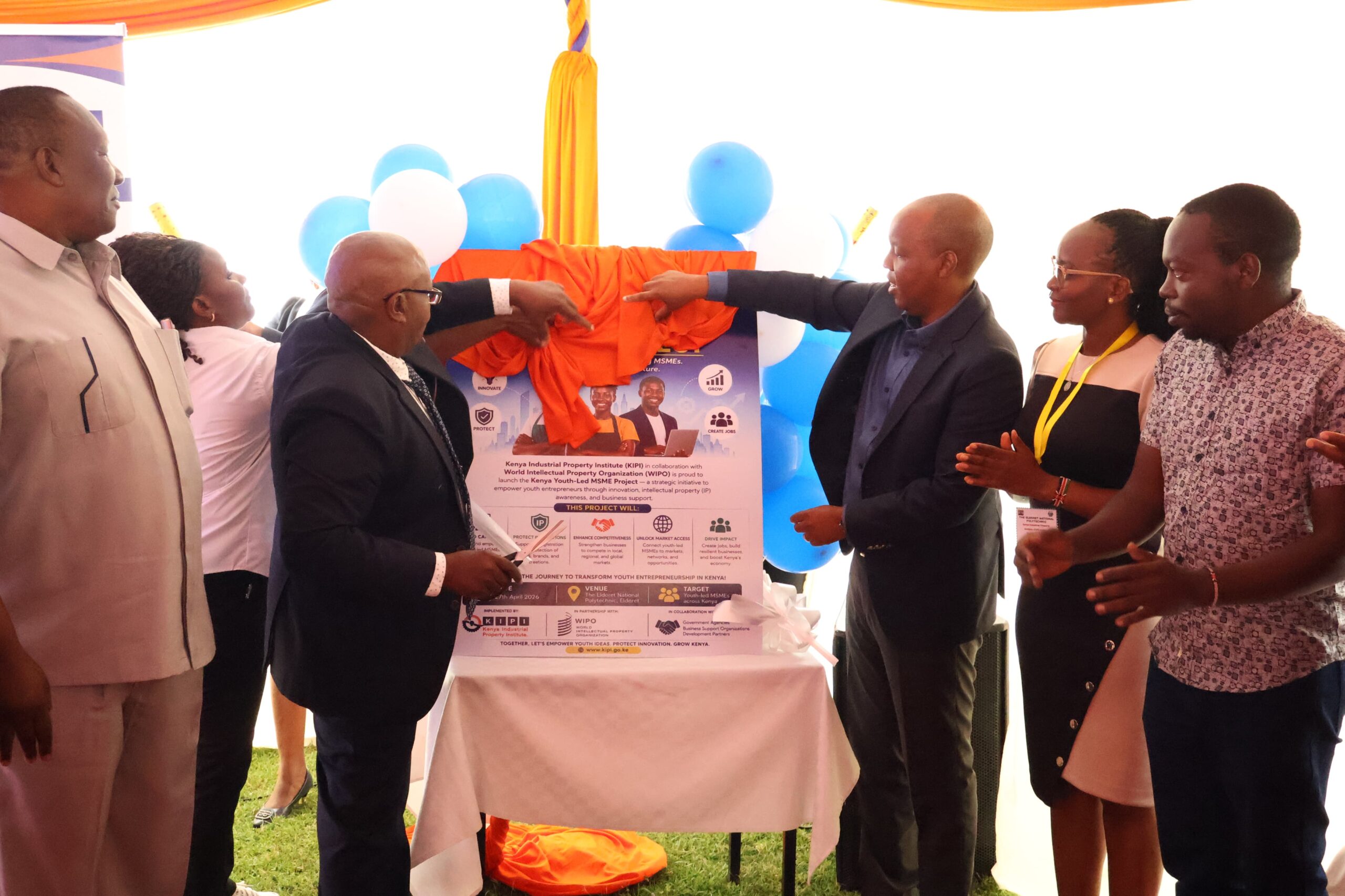 KIPI Secretary Administration Karanja Njora and Board Chairman Allan Kosgey launch the Youth-led MSMEs Project at Eldoret National Polytechnic during an event highlighting innovation and intellectual property support for young entrepreneurs.