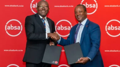 Absa Bank Kenya Interim CEO Yusuf Omari shakes hands with Unilever Kenya Managing Director Luck Ochieng during the launch of a KES 4 billion distributor financing programme.