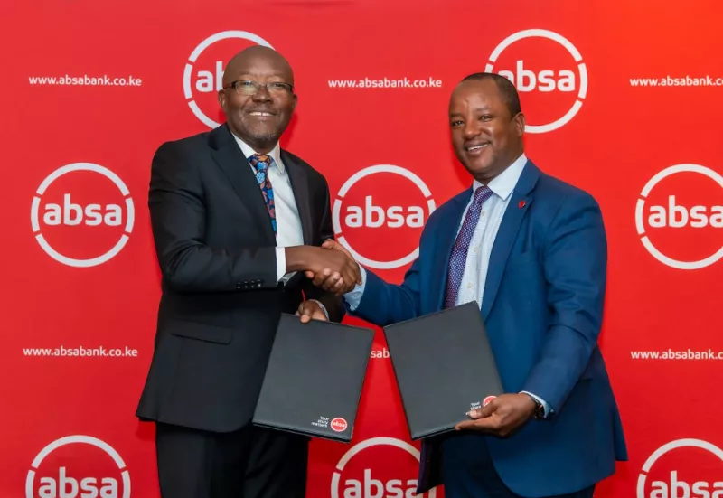 Absa Bank Kenya Interim CEO Yusuf Omari shakes hands with Unilever Kenya Managing Director Luck Ochieng during the launch of a KES 4 billion distributor financing programme.