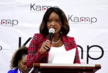 Kenya Association of Music Producers Chairperson Angela Ndambuki speaks at a podium during an official KAMP media briefing.