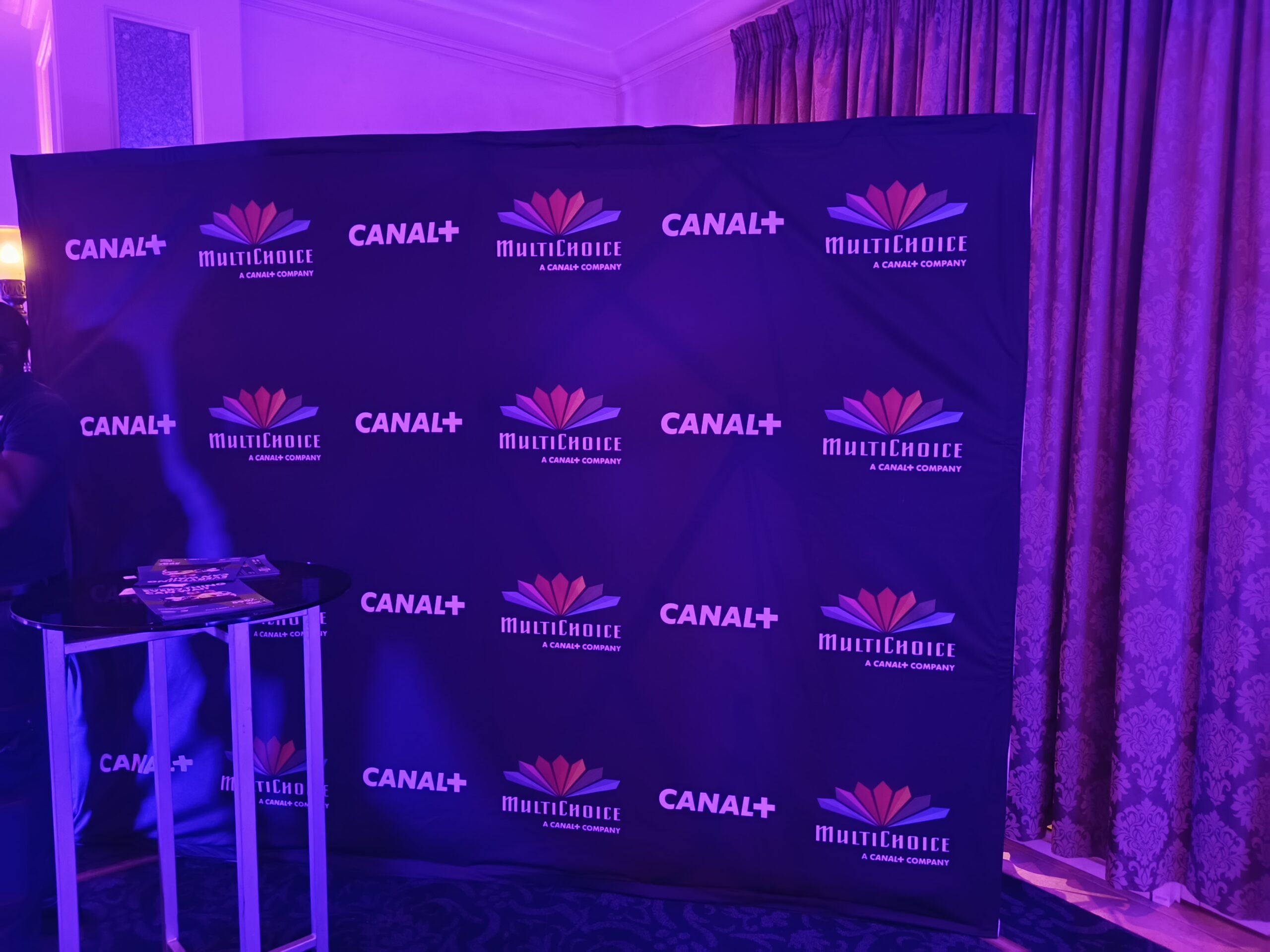 Canal+ and MultiChoice branded backdrop displaying "MultiChoice, A Canal+ Company" after completion of the acquisition.