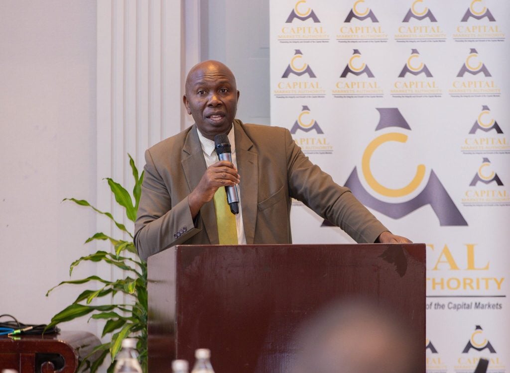 CMA CEO Wyckliffe Shamiah speaking at a Capital Markets Authority event announcing new unit trust fund approvals and expanded regulated investment products in Kenya.
