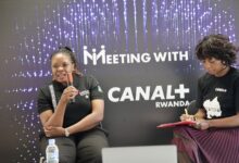 Fhulufhelo Badugela, then a member of Canal+'s Transformation and Integration team, speaks during a CANAL+ Rwanda "Meeting With" session as Sophie Tchatchoua, CEO of CANAL+ Rwanda, takes notes following Canal+'s acquisition of MultiChoice.