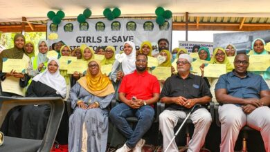 Participants pose with certificates during a Girls-I Save Africa graduation ceremony after completing STEM, digital skills and entrepreneurship training in Kenya.