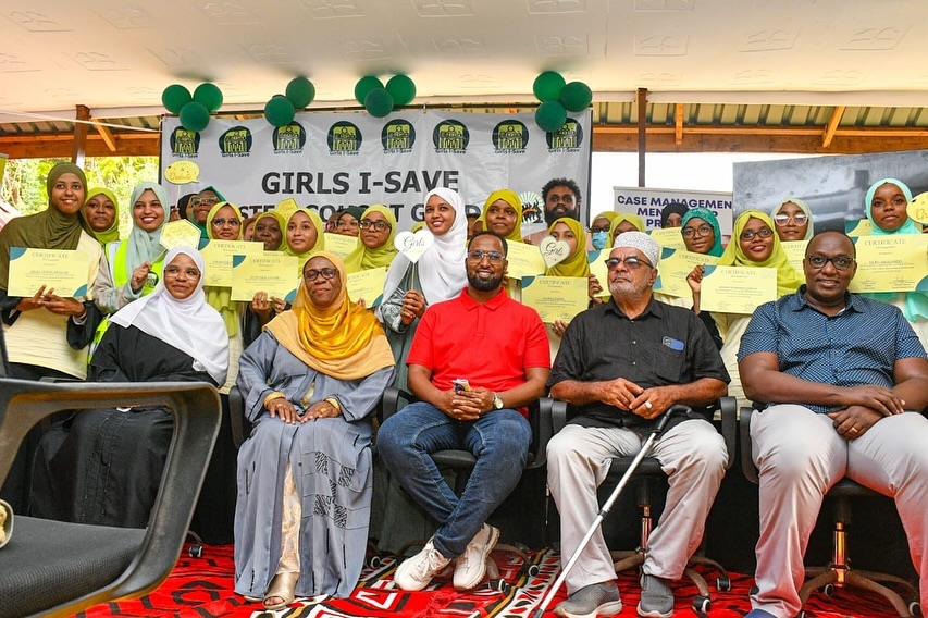 Participants pose with certificates during a Girls-I Save Africa graduation ceremony after completing STEM, digital skills and entrepreneurship training in Kenya.