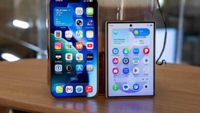 An iPhone and an Android smartphone displayed at an electronics store in Kenya, illustrating new Communications Authority warranty rules for phones, tablets and laptops sold by licensed vendors.