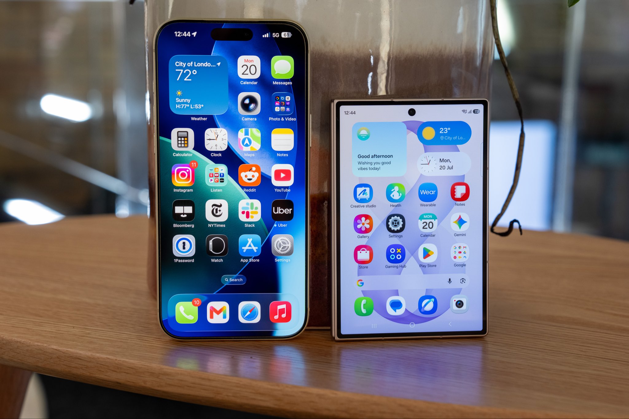 An iPhone and an Android smartphone displayed at an electronics store in Kenya, illustrating new Communications Authority warranty rules for phones, tablets and laptops sold by licensed vendors.