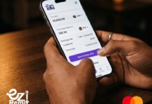 Smartphone displaying the eZi Remit app for a South Africa to Kenya money transfer powered by Mastercard Move.