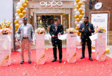 OPPO executives cut the ribbon during the opening of the new OPPO Experience Shop at The Hub Karen in Nairobi, surrounded by launch decorations and confetti.
