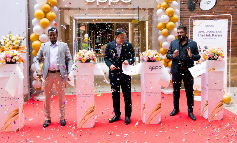 OPPO executives cut the ribbon during the opening of the new OPPO Experience Shop at The Hub Karen in Nairobi, surrounded by launch decorations and confetti.