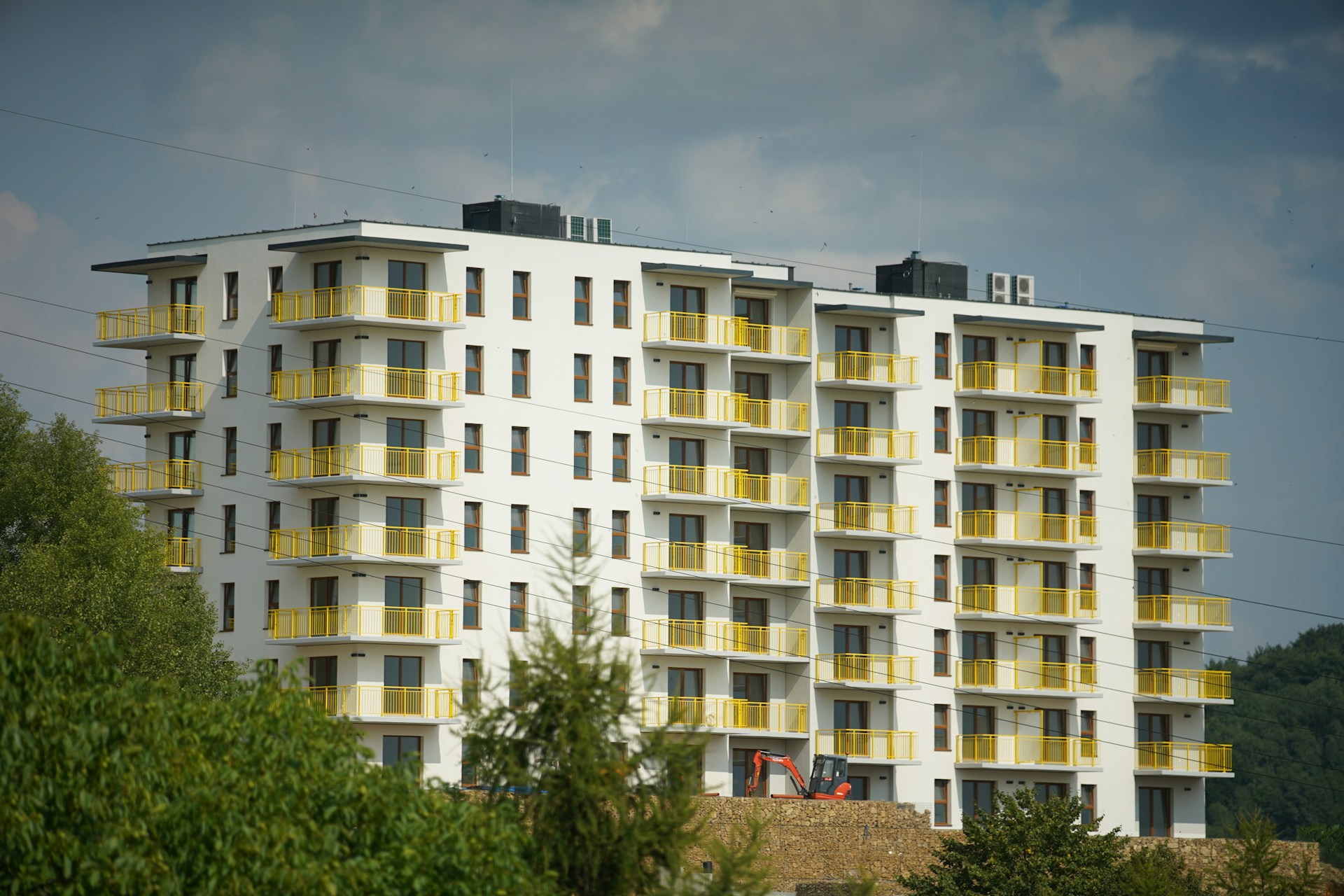 A multi-storey apartment building with yellow balconies, representing residential property in Kenya as PrimeVale launches a digital platform offering property listings, market insights and educational resources.