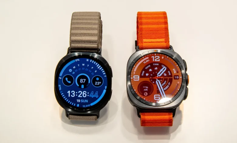 Samsung Galaxy Watch 9 and Galaxy Watch Ultra 2 displayed side by side with their watch faces turned on.
