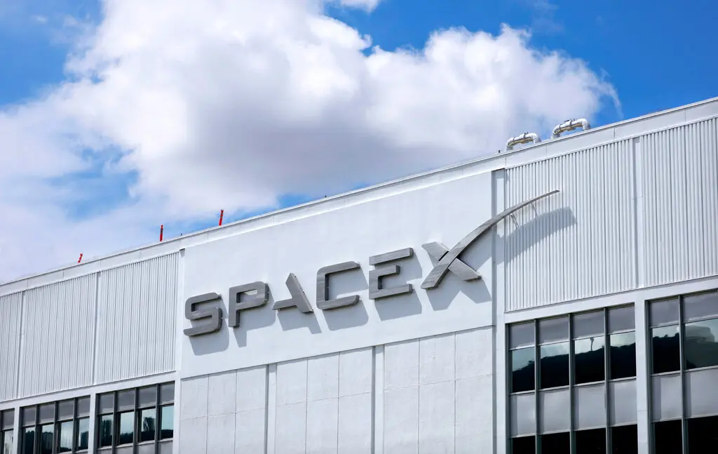 Exterior of a SpaceX office building with the company's logo displayed on the facade following the launch of the new SpaceXAI brand.