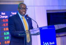 Tom Mulwa addresses delegates during the Nairobi Securities Exchange listing ceremony for I&M Group PLC's Medium Term Note.