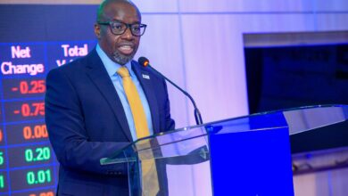 Tom Mulwa addresses delegates during the Nairobi Securities Exchange listing ceremony for I&M Group PLC's Medium Term Note.