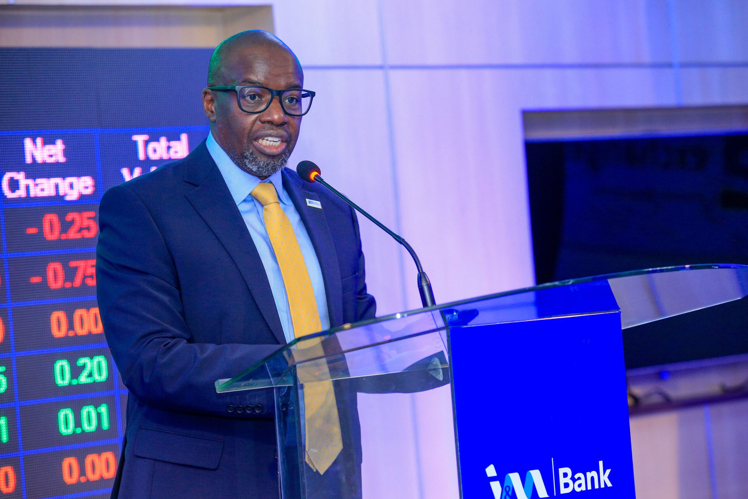 Tom Mulwa addresses delegates during the Nairobi Securities Exchange listing ceremony for I&M Group PLC's Medium Term Note.