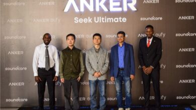 John Kiprotich, Anker Kenya Country Manager, stands with Anker executives in front of Anker, Soundcore and Eufy branding during the Kenya launch event in Nairobi.