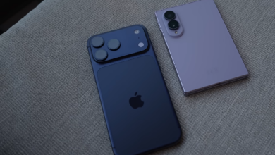 Apple iPhone 17 Pro beside a Samsung Galaxy Z Fold8 on a fabric surface, illustrating competition between iPhone and Android flagships.