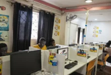 Customers using computers at a cyber café in Kenya