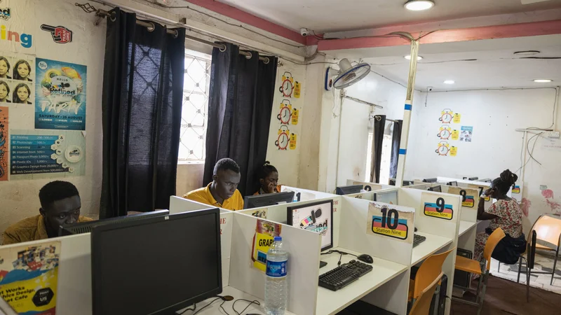 Customers using computers at a cyber café in Kenya