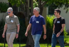 Tim Cook, Eddy Cue and John Ternus walking together at Apple