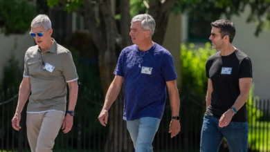 Tim Cook, Eddy Cue and John Ternus walking together at Apple