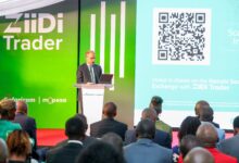 Safaricom Chief Financial Officer Dilip Pal speaks at the ZiiDi Trader launch event at the Nairobi Securities Exchange with ZiiDi Trader branding displayed behind him.