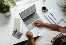 Financial records on a laptop representing trust ownership and beneficial ownership compliance in Kenya