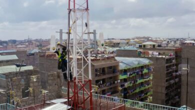 Technician installing Taara wireless optical communication equipment on a telecom tower in Lagos, Nigeria.