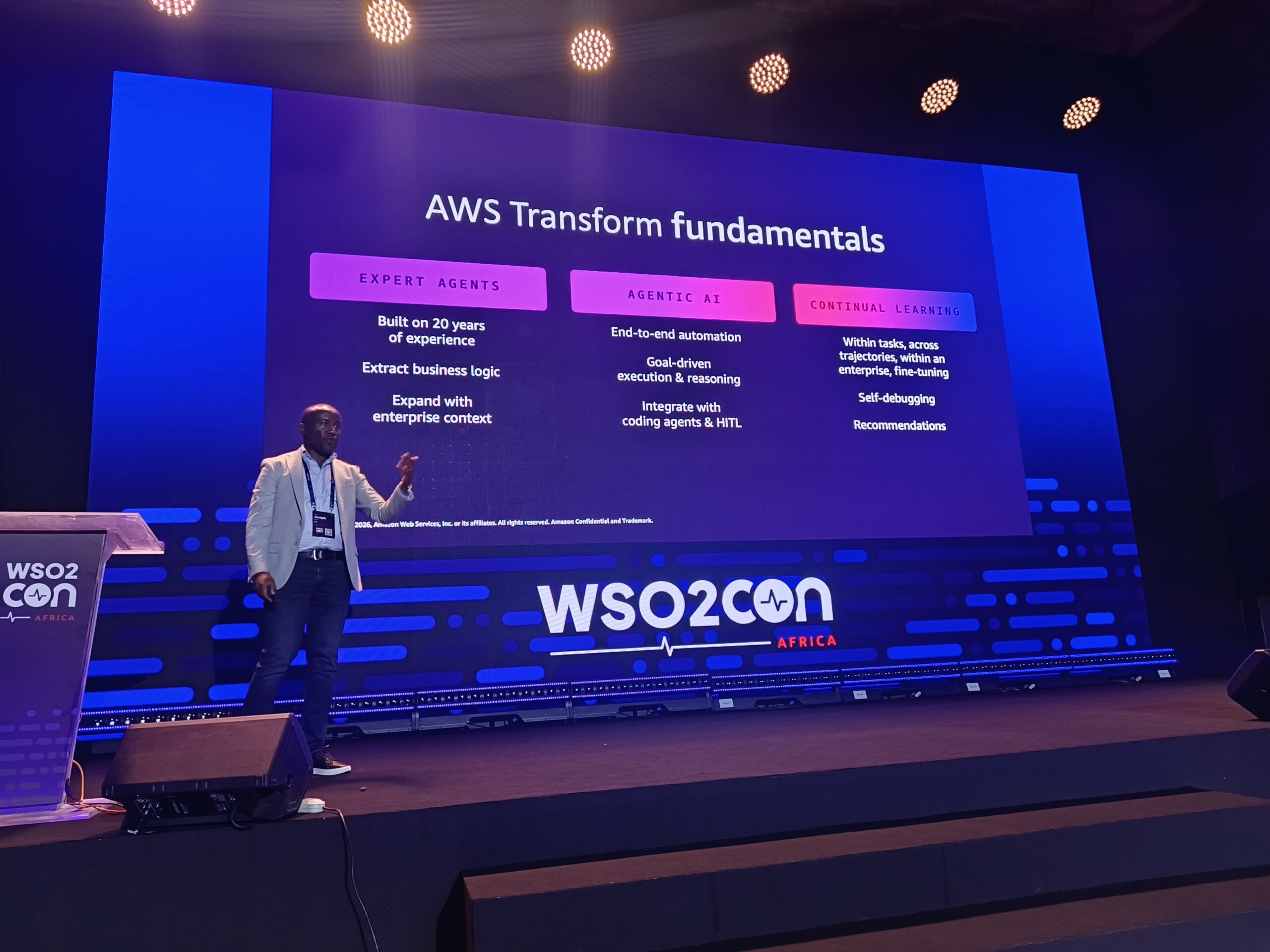 AWS Senior Solutions Architect Joseph Mutua presenting AWS Transform fundamentals and agentic software development models at WSO2Con Africa 2026 in Nairobi.