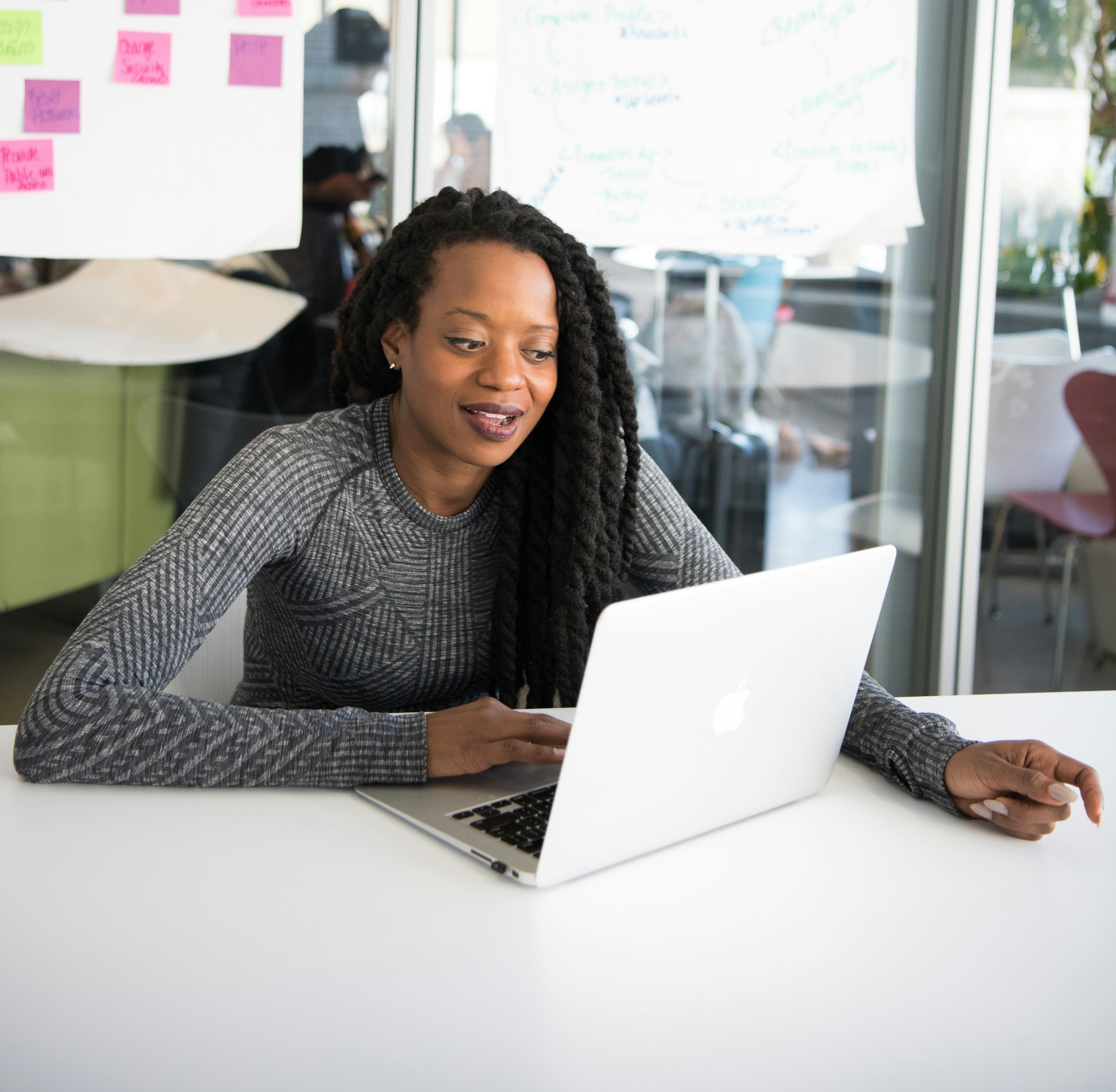 Kenyan businesswoman using a laptop for digital business banking with Equity Online for Business