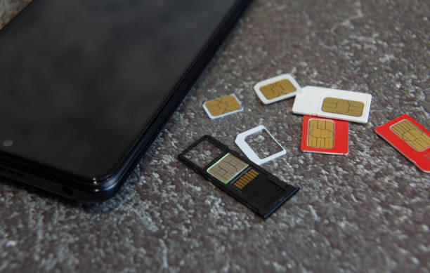 SIM cards and smartphone illustrating mobile number recycling in Kenya