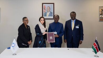 Kenya's William Kabogo Gitau hands the signed Digital Cooperation Organization Charter to Secretary-General Deemah AlYahya in New York