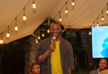 Big Cabal Media CEO Tomiwa Aladekomo speaks at TechCabal's Road to Moonshot mixer in Nairobi.