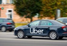 Uber-branded car driving on a South African road