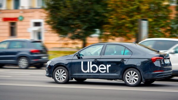 Uber-branded car driving on a South African road
