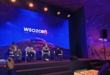 Panel discussion at WSO2Con Africa featuring Tonny Bbosa, Harrison Chapu, Hamda Al Issaei, and Dev Wijewardane discussing AI implementation in government and public services in Nairobi.