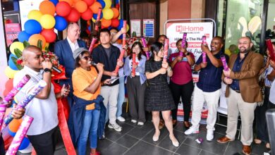 HiHome store management, staff, and The Hub Karen Mall Manager Jacobus Visser popping party poppers during the grand opening ribbon-cutting event at The Hub Karen.