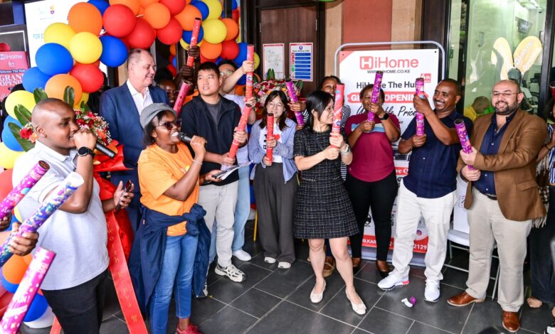 HiHome store management, staff, and The Hub Karen Mall Manager Jacobus Visser popping party poppers during the grand opening ribbon-cutting event at The Hub Karen.