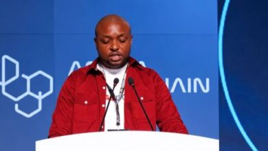 Kelechi Uchegbulam, CEO of Passpoint, speaking at a podium during his keynote address at the Africa Blockchain Festival 2026 in Nairobi.