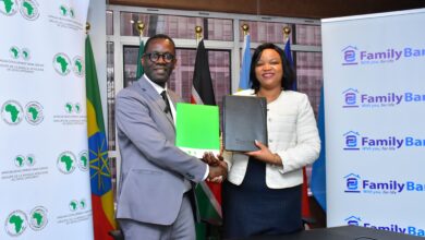 AfDB East Africa Director General Dr. Alex Mubiru and Family Bank CEO Nancy Njau sign $10M trade finance facility agreement.